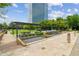 Beautiful greenspace with water feature, pergolas, landscaping, and a skyscraper in the background at 10 Perimeter Summit Ne Blvd # 4243, Brookhaven, GA 30319
