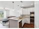 Bright kitchen featuring white cabinets, stainless appliances, and a peninsula with granite countertops at 10 Perimeter Summit Ne Blvd # 4243, Brookhaven, GA 30319