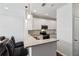 Open concept kitchen with white cabinets, stainless appliances, granite counters and island that opens into living area at 10 Perimeter Summit Ne Blvd # 4243, Brookhaven, GA 30319