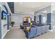 Comfortable sitting area with a large sectional sofa, TV, and view into the kitchenette space at 10 Perimeter Summit Ne Blvd # 4243, Brookhaven, GA 30319