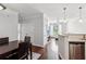 Open-concept living space with hardwood floors, connecting the kitchen, dining, and living areas at 10 Perimeter Summit Ne Blvd # 4243, Brookhaven, GA 30319