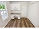 Charming office space with custom cabinets, drawers, countertop, and wood-look flooring, filled with natural light at 145 Shadowbrook Trce, Covington, GA 30016