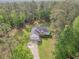 An aerial view of a charming home nestled in a lush forest setting at 2180 Briarwood Ct, Villa Rica, GA 30180