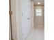 Bathroom features a bathtub, shower with glass door, white patterned wallpaper, and tile floors at 2180 Briarwood Ct, Villa Rica, GA 30180