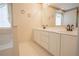 Bathroom featuring a double vanity with white cabinets, and tile floors at 2180 Briarwood Ct, Villa Rica, GA 30180