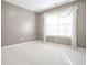 Bedroom featuring neutral walls, carpet, and a bright window with sheer curtains at 2180 Briarwood Ct, Villa Rica, GA 30180