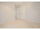 This bedroom offers white walls, neutral carpet, and a double door closet at 2180 Briarwood Ct, Villa Rica, GA 30180