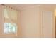 Bedroom with a window bringing in natural light, neutral-toned walls, and a white interior door at 2180 Briarwood Ct, Villa Rica, GA 30180