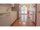 Well-maintained kitchen with white cabinetry, stainless steel appliances, and hardwood floors at 2180 Briarwood Ct, Villa Rica, GA 30180