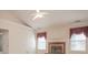 Bright living room featuring a fireplace, windows with valances, and neutral paint at 2180 Briarwood Ct, Villa Rica, GA 30180