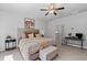 Serene bedroom with neutral tones, a ceiling fan, and ample natural light for a comfortable retreat at 2534 Norwood Park Xing, Atlanta, GA 30340