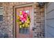 Close-up of a cheerful front door adorned with a bright wreath and smart lock at 2534 Norwood Park Xing, Atlanta, GA 30340