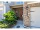 Exterior view of townhome featuring a well-maintained yard and attached garage at 2534 Norwood Park Xing, Atlanta, GA 30340