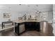 Open kitchen with dark cabinetry, stainless steel appliances, and a spacious island at 2534 Norwood Park Xing, Atlanta, GA 30340