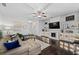 Stylish living room with built-in shelving, fireplace, and ample natural light at 2534 Norwood Park Xing, Atlanta, GA 30340