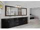 Spacious main bathroom with a dual sink vanity, a large mirror, and a separate shower at 2534 Norwood Park Xing, Atlanta, GA 30340