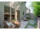 Cozy patio seating area perfect for relaxing outdoors, surrounded by lush greenery and privacy fence at 2534 Norwood Park Xing, Atlanta, GA 30340