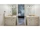 Well-appointed bathroom featuring double vanities and a doorway view into the bedroom at 3113 Lenox Ne Rd # 6, Atlanta, GA 30324