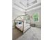 Charming bedroom features a unique bed frame, tray ceiling, and windows for ample natural light at 3113 Lenox Ne Rd # 6, Atlanta, GA 30324