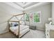 Charming bedroom features a unique bed frame, tray ceiling, and windows for ample natural light at 3113 Lenox Ne Rd # 6, Atlanta, GA 30324