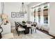 Elegant dining room with modern chandelier, stylish furniture, and large bright windows at 3113 Lenox Ne Rd # 6, Atlanta, GA 30324