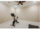Home exercise room featuring carpeted floors, a ceiling fan, and an exercise bike for convenient workouts at 3113 Lenox Ne Rd # 6, Atlanta, GA 30324
