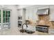 Gourmet kitchen with stainless steel appliances, granite countertops, and access to the balcony at 3113 Lenox Ne Rd # 6, Atlanta, GA 30324
