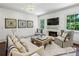 Bright living room with fireplace, chandelier, and decorative area rug at 3113 Lenox Ne Rd # 6, Atlanta, GA 30324