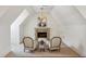 Cozy sitting area featuring a fireplace, chandelier, and carpeted floors at 3113 Lenox Ne Rd # 6, Atlanta, GA 30324