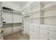 Spacious walk-in closet with custom shelving, drawers, and ample storage space at 3113 Lenox Ne Rd # 6, Atlanta, GA 30324