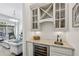 Stylish wet bar featuring granite countertops, a wine fridge and glass-front cabinets at 3113 Lenox Ne Rd # 6, Atlanta, GA 30324
