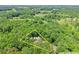 Aerial view of the property on a +/- 1.07 acre lot surrounded by trees and countryside at 2170 Jonquil Ct, Canton, GA 30115
