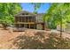 Backyard view with a screened porch, deck, porch swing, landscaping, and storage shed at 2170 Jonquil Ct, Canton, GA 30115