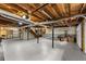 Unfinished basement featuring epoxy floors, utility hook-ups, and open joist ceiling at 2170 Jonquil Ct, Canton, GA 30115