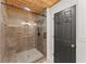 Bathroom featuring a glass-enclosed shower with tile surround at 2170 Jonquil Ct, Canton, GA 30115