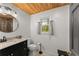 Bathroom showcasing a vanity, window, toilet, and shower at 2170 Jonquil Ct, Canton, GA 30115