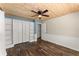 Bedroom showcasing hardwood floors, built in shelving, and a ceiling fan at 2170 Jonquil Ct, Canton, GA 30115