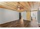 Comfortable bedroom featuring a wood ceiling, modern ceiling fan, and stylish barn door at 2170 Jonquil Ct, Canton, GA 30115