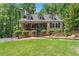 Charming home with a well-manicured lawn, inviting front porch, and mature trees at 2170 Jonquil Ct, Canton, GA 30115