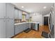 Charming kitchen with blue cabinets, stainless steel appliances, and ample counter space at 2170 Jonquil Ct, Canton, GA 30115