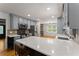 Stylish kitchen with updated appliances, a breakfast bar, and views into the living area at 2170 Jonquil Ct, Canton, GA 30115