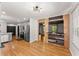 Open-concept kitchen flowing into the dining area with a bar and stainless steel appliances at 2170 Jonquil Ct, Canton, GA 30115