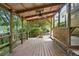 Spacious wooden back deck with ceiling fan, perfect for outdoor entertaining and enjoying the backyard at 2384 Shadowood Sw Dr, Conyers, GA 30094