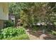 Backyard view, showcasing lush landscaping and patio, providing a serene outdoor living space at 2384 Shadowood Sw Dr, Conyers, GA 30094