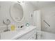 Bathroom boasts a white countertop and vanity, along with a shower-over-tub combo at 2384 Shadowood Sw Dr, Conyers, GA 30094
