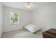 Bedroom featuring neutral colors, a window and closet at 2384 Shadowood Sw Dr, Conyers, GA 30094