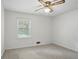 Bedroom with a ceiling fan, carpeted flooring and bright white walls at 2384 Shadowood Sw Dr, Conyers, GA 30094