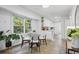 Bright dining area with a round table, comfortable chairs, and an open view of the well-lit kitchen at 2384 Shadowood Sw Dr, Conyers, GA 30094
