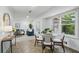 Charming dining area with ample natural light, a stylish table set, and a seamless flow to the living room at 2384 Shadowood Sw Dr, Conyers, GA 30094