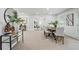Open concept dining room with a modern table, neutral carpet, and an adjacent living room at 2384 Shadowood Sw Dr, Conyers, GA 30094